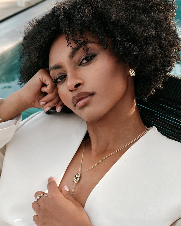 Necklace in silver and gold plated-316L stainless steel from Waldor & Co. The model is Dual Knot Necklace Polished.
