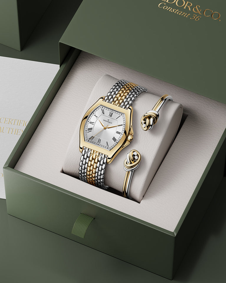  A square womens watch in 22k two-toned silver and gold plated 316L stainless steel from Waldor & Co. with domed mineral glass dial. Seiko movement. The model is Constant 36 Menaggio.