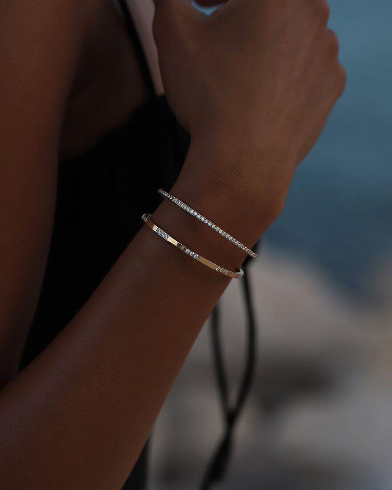 A Bangle in 14k gold-plated 316L stainless steel from Waldor & Co. One size. The model is Dulcet Bangle Polished.