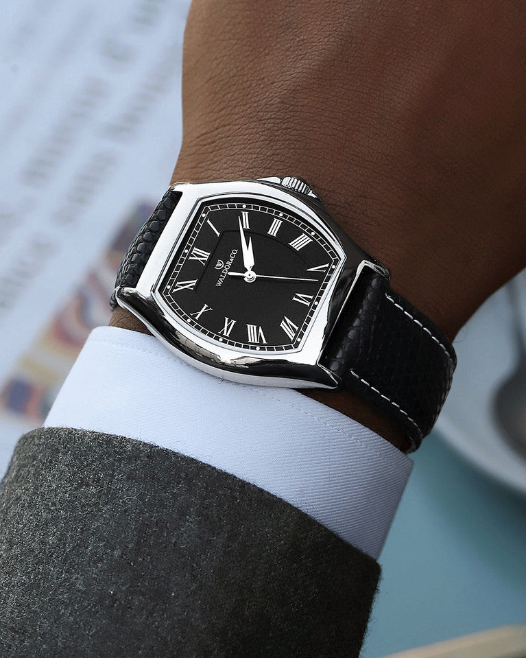 A square mens watch in Rhodium-plated 316L stainless steel from Waldor & Co. with white dial. Ronda movement. The model is Constant 40 Tremezzo 37x45mm.