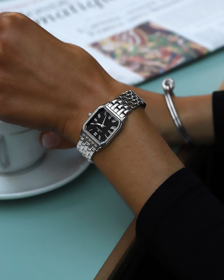 A square womens watch in silver plated 316L stainless steel from Waldor & Co. with black Diamond Cut Sapphire Crystal glass dial. Seiko movement. The model is Eternal 22 Bellagio