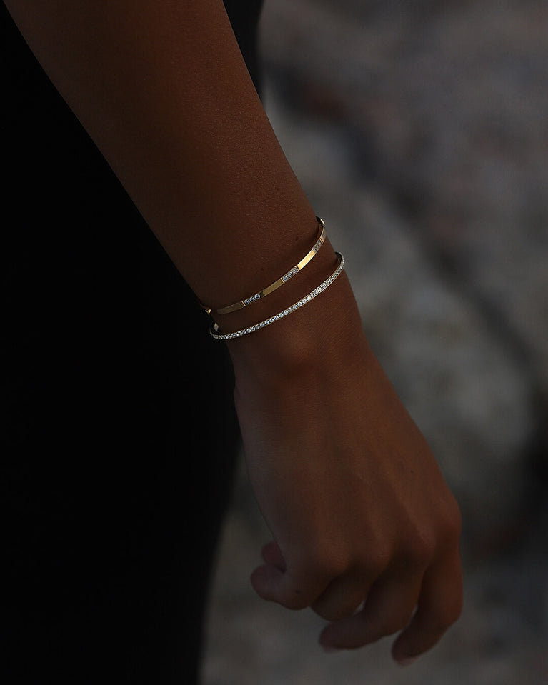 A Bangle in 14k gold-plated 316L stainless steel from Waldor & Co. One size. The model is Dulcet Bangle Polished.