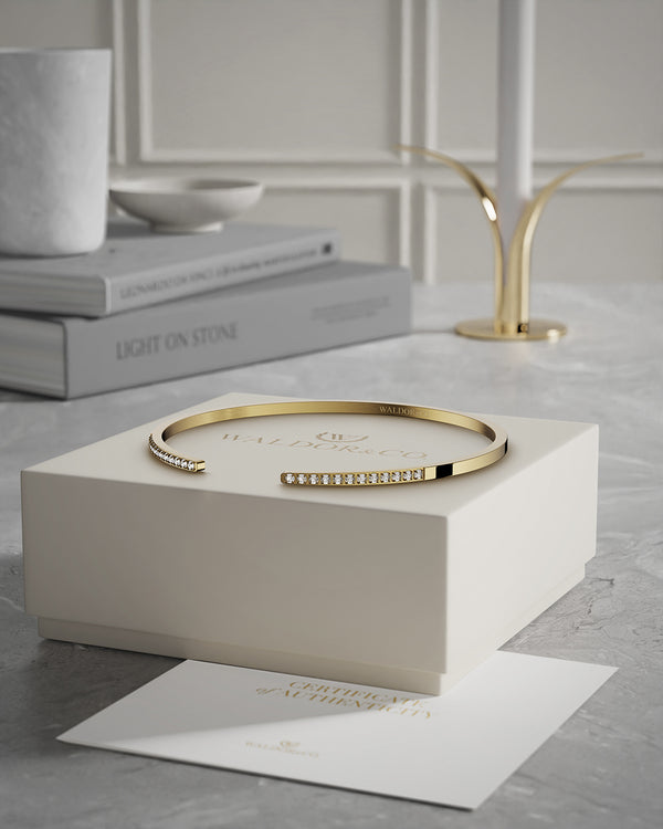 A Bangle in 14k gold plated 316L stainless steel from Waldor & Co. One size. The model is Acme Bangle Polished.