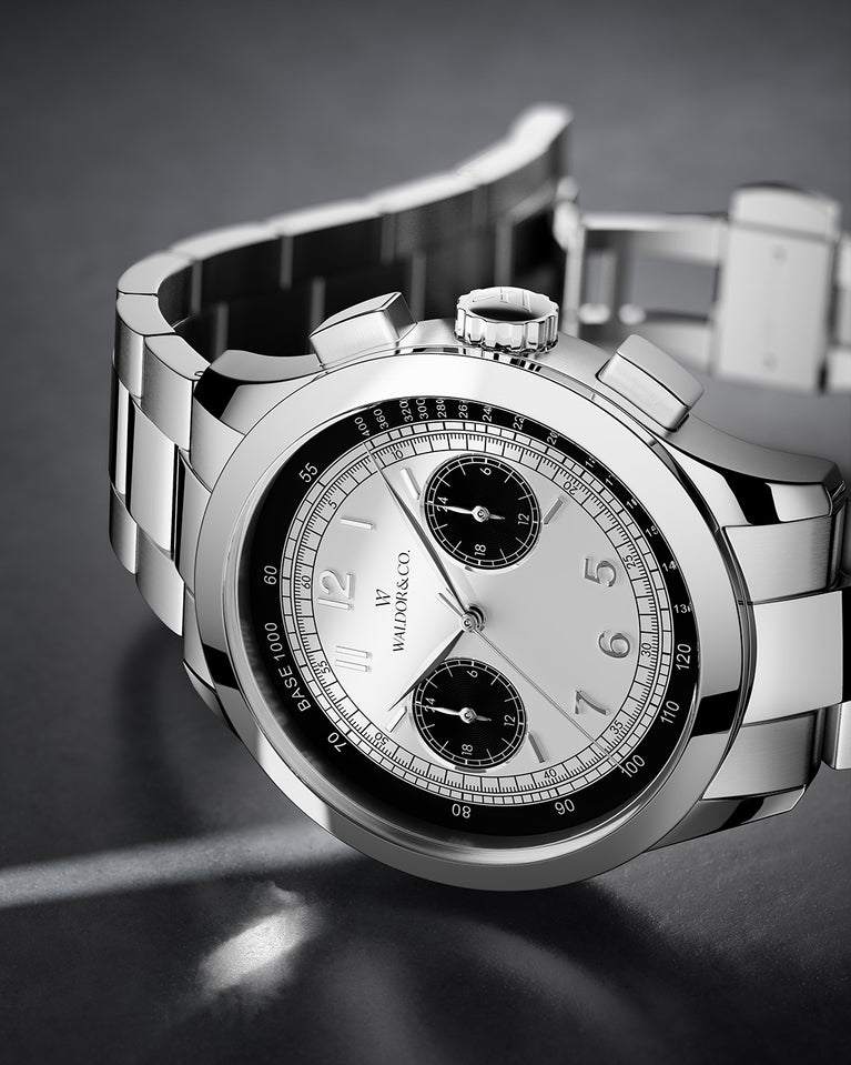 A round mens watch in rhodium-plated silver from Waldor & Co. with black and white sunray dial and a second hand. Seiko movement. The model is Chrono 39 Panda Ltd. Edition