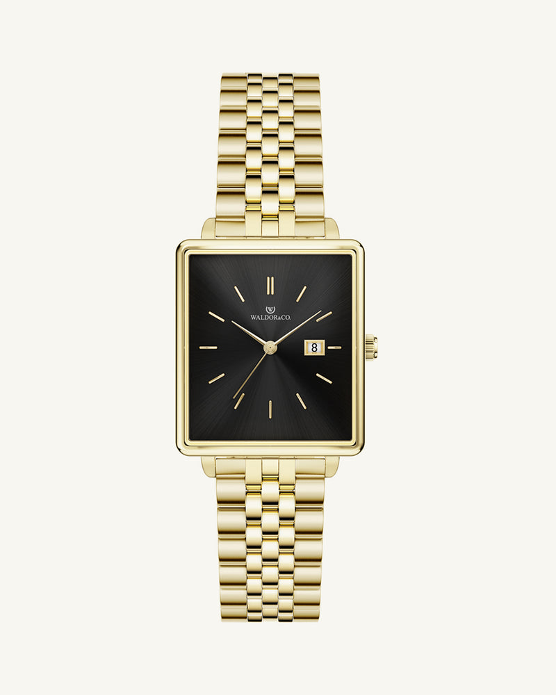 A square womens watch in silver and 14k gold from Waldor & Co. with black sunray dial and a second hand. Seiko movement. The model is Delight 32 Chelsea 28x32mm.