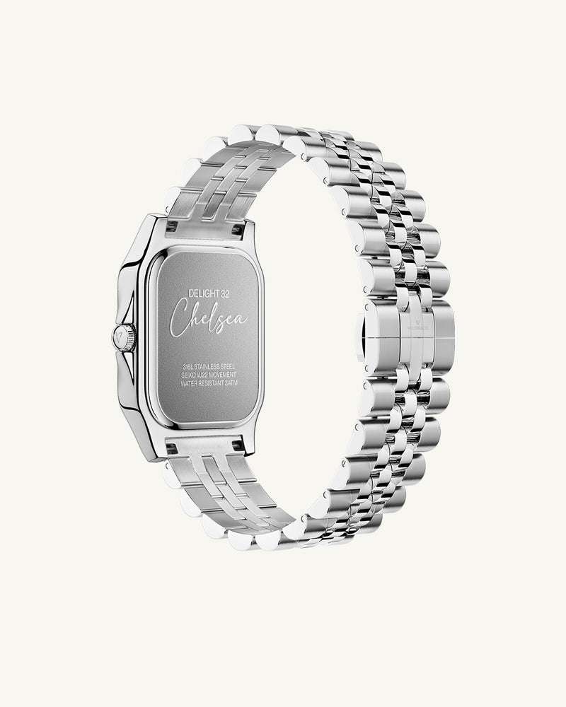 A square womens watch in silver and 14k gold from Waldor & Co. with light blue sunray dial and a second hand. Seiko movement. The model is Delight 32 Chelsea 28x32mm.