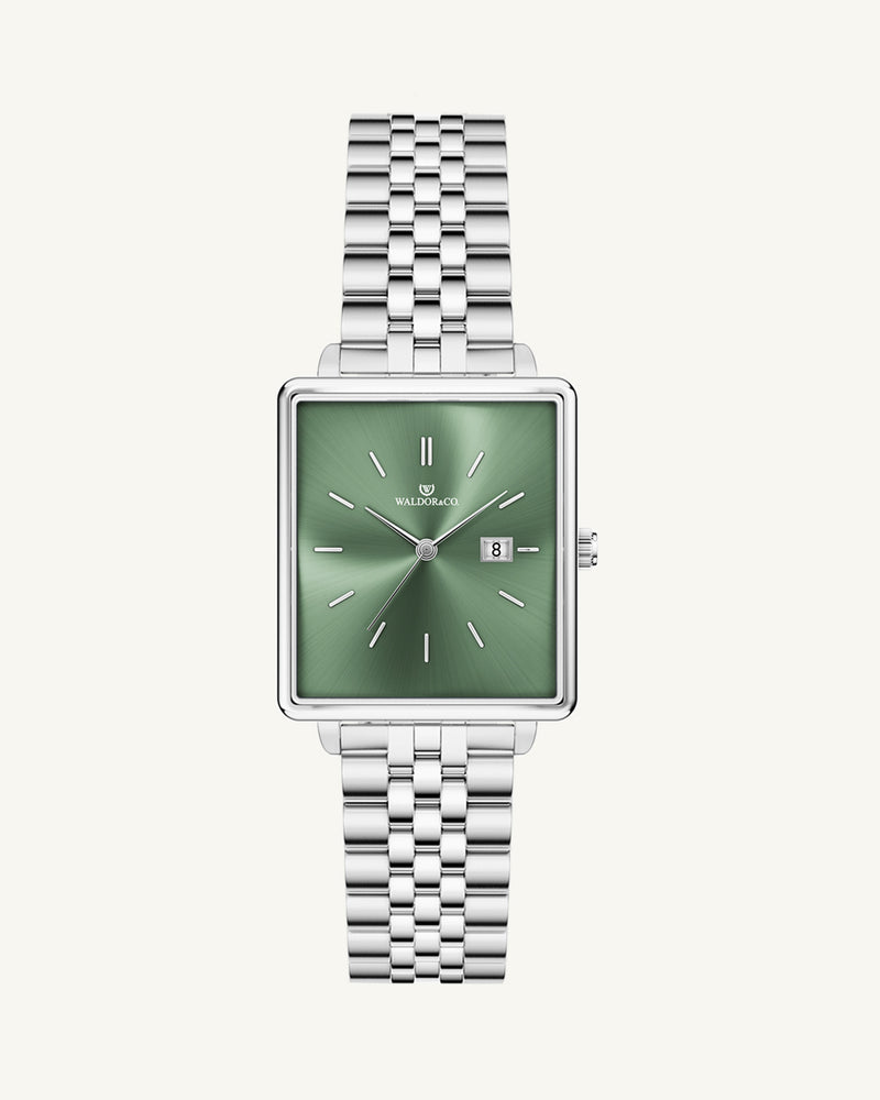 A square womens watch in silver from WALDOR & CO. with green sunray dial and a second hand. The model is Delight 32 Chelsea 28x32mm.