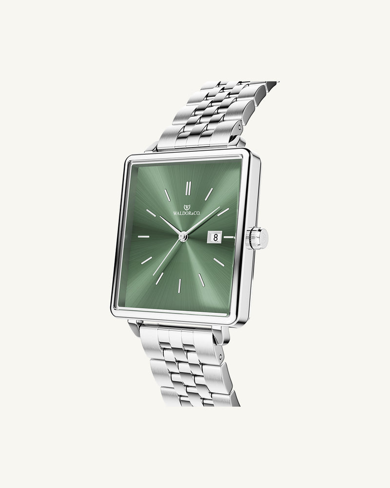 A square womens watch in silver from WALDOR & CO. with green sunray dial and a second hand. The model is Delight 32 Chelsea 28x32mm.