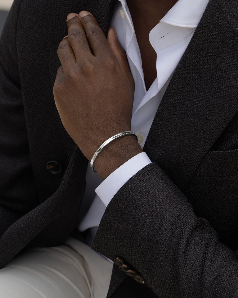 A Square Bangle in 925 Sterling Silver from Waldor & Co. The model is Demure Bangle Sterling Silver.