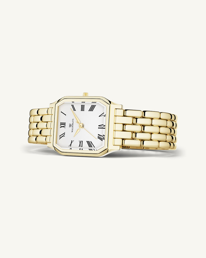 A square womens watch in 22k gold from Waldor & Co. with white Diamond Cut Sapphire Crystal glass dial. Seiko movement. The model is Eternal 22 Bellagio.