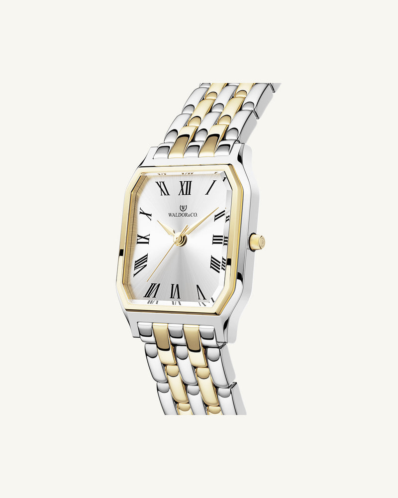 A square womens watch in 22k gold plated 316L stainless steel from Waldor & Co. with white Diamond Cut Sapphire Crystal glass dial. Seiko movement. The model is Eternal 22 Bellagio