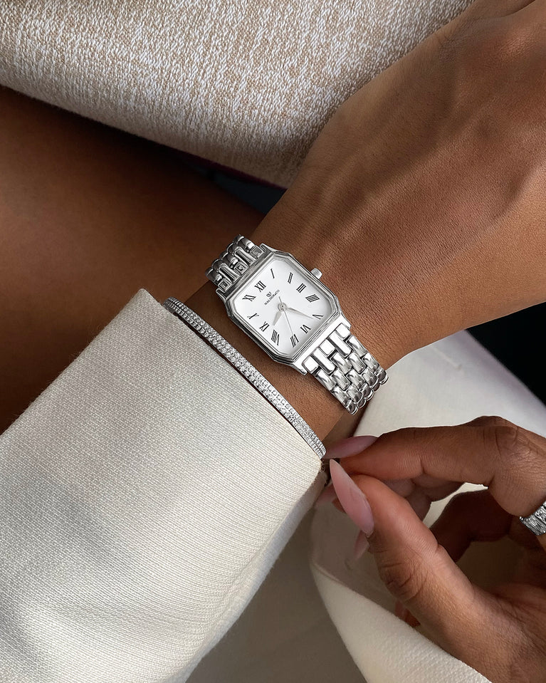 A square womens watch in Rhodium-plated 316L stainless steel from Waldor & Co. with white Diamond Cut Sapphire Crystal glass dial. Seiko movement. The model is Eternal 22 Bellagio.