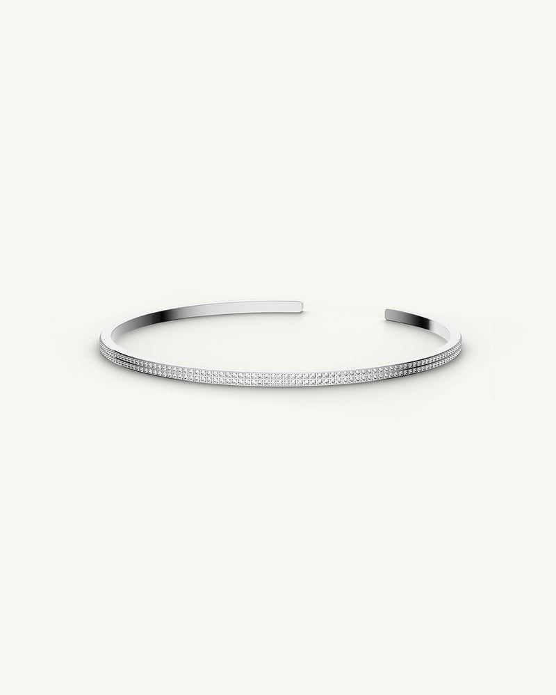 A Bangle Bracelet in polished Silver plated-316L stainless steel from Waldor & Co. The model is Pavé Bangle Polished.